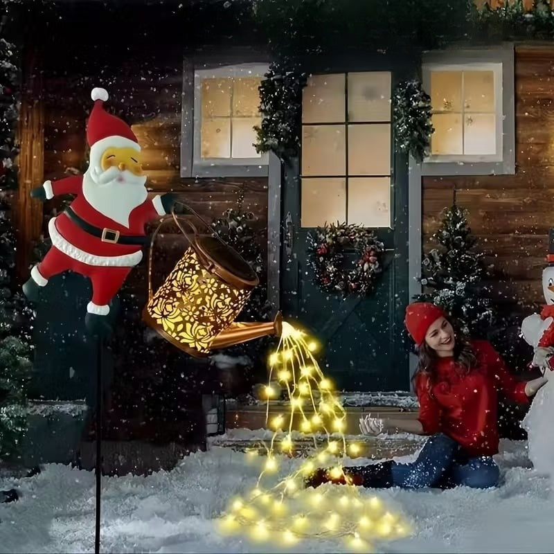 Ziemassvētku vecīša laistāmā kanna ar saules bateriju un zemē ieduramu statīvu